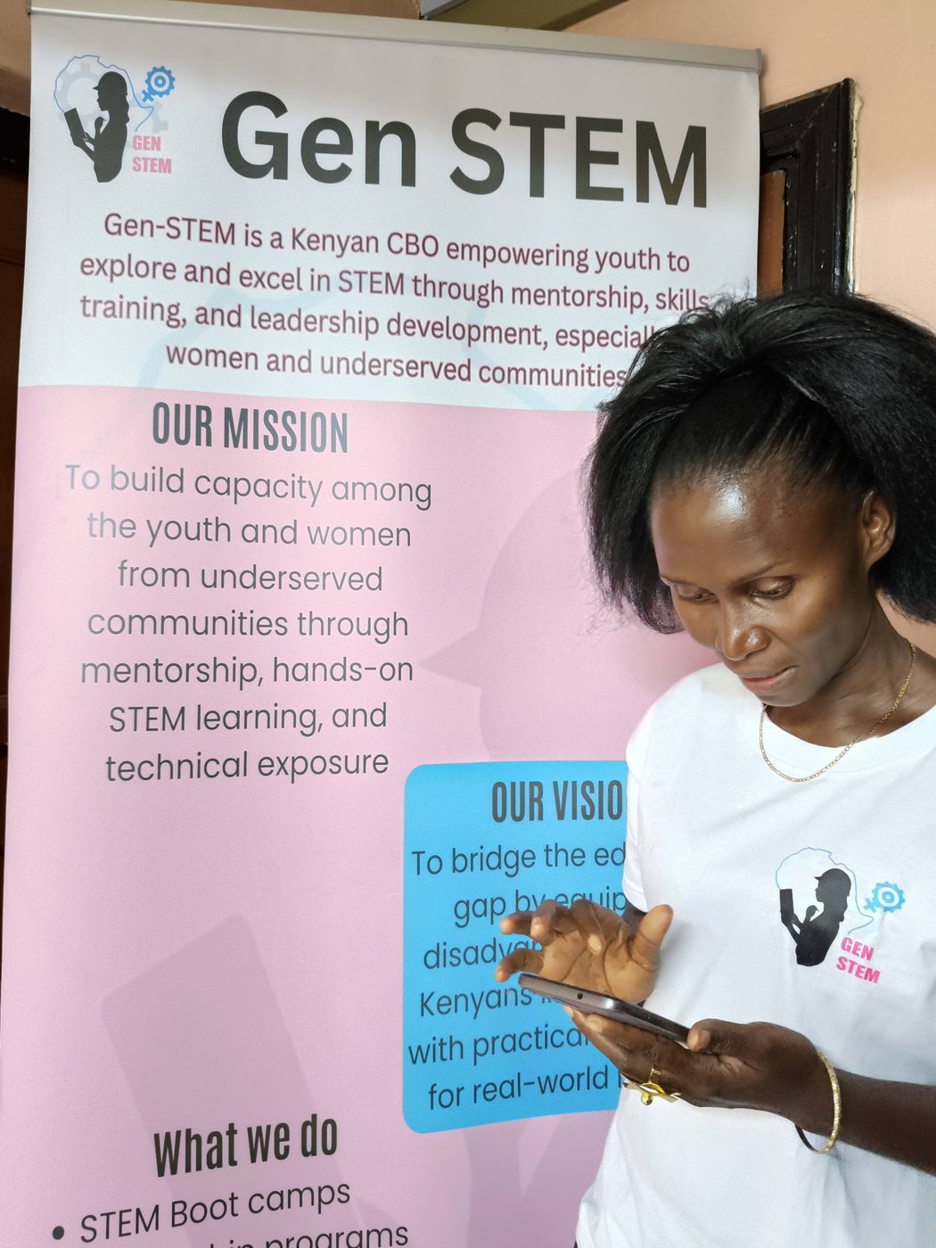 A young engineer smiling during a GenSTEM showcase